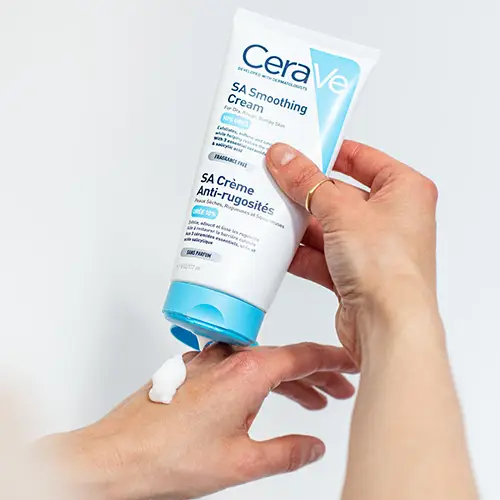 Person applying CeraVe SA Smoothing Cream to the back of their hand